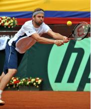 Mardy Fish 2 handed backhand defense on red clay.JPG