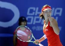 Peng Shuai celebrates in a red tennis dress at the 2010 China Open.JPG