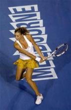 Maria Kirilenko gets ready to smack a backhand.jpg