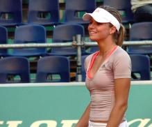 Maria Kirilenko smiles in her tennis wear.jpg