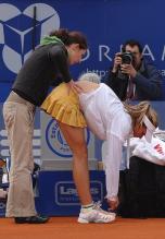 Maria Kirilenko gets her back massaged.jpg