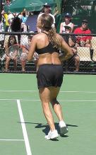 Amelie Mauresmo in black sports bra and shorts.jpg