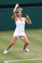 Amelie Mauresmo swing follow through.jpg