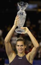 Mauresmo holds up the WTA Championships trophy.jpg