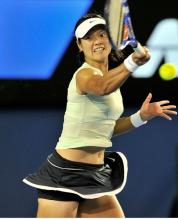Li Na drives a forehand on a high ball during the Australian Open 2011 finals.JPG