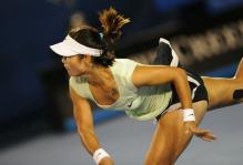 Li Na follows through on her serve during the 2011 Australian Open.JPG