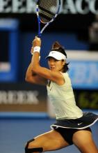Li Na two handed backhand high follow through during the 2011 Australian Open finals.JPG
