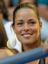 Ana Ivanovic smiles wearing big earrings.JPG