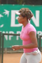 Venus Williams practices in pink top and tights.jpg
