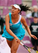 Peng Shuai follows through on her serve during the French Open 2011.JPG