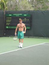 Robby Ginepri practices without a shirt on.jpg