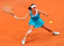 Peng Shuai goes for the forehand slice at the 2011 French Open.JPG
