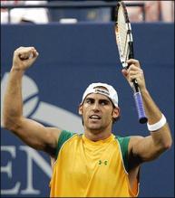 Robby Ginepri raises his arms in victory.jpg