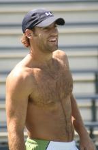 Robby Ginepri smiles in baseball cap without a shirt on.jpg