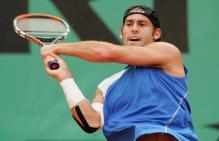 Robby Ginepri two-handed backhand followthrough.jpg