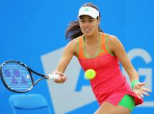 Ana Ivanovic forehand on the move in a pink tennis outfit.JPG