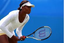 Venus Williams awaits to return the serve at Eastbourne 2011.JPG