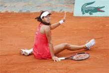 Ana Ivanovic falls to the clay.jpg