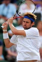 Mardy Fish double handed backhand follow through during 2011 Wimbledon.JPG