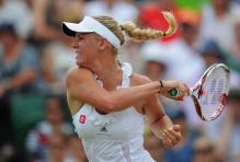 Caroline Wozniacki rips a forehand during Wimbledon 2011.JPG