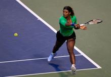 Serena Williams backhand slice on the run during Rogers Cup 2011.JPG