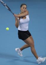 Tamira Paszek 2 handed backhand follow through.JPG