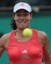 Ana Ivanovic stares at a ball in front of her in this funny picture.jpg