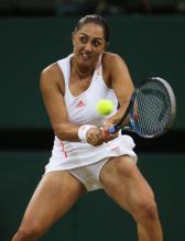Tamira Paszek 2 handed backhand with open stance during 2012 Wimbledon.JPG