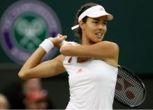 Ana Ivanovic 2 handed backhand follow through during 2012 Wimbledon.JPG
