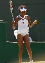 Venus Williams in a tight white dress during Wimbledon 2008.jpg