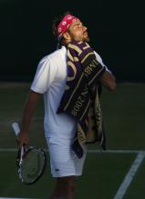 Arnaud Clement wipes himself with a towel in Wimbledon 2008.jpg