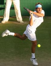 Arnaud Clement hits a two-handed backhand.jpg