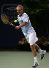 John McEnroe hits a backhand volley.jpg