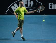 John McEnroe hits a forehand.jpg