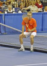 John McEnroe sits on the net.jpg