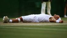 Rafael Nadal lays prostrate on the ground after becoming the 2008 Wimbledon Champion.jpg