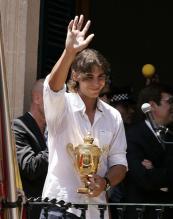 Rafael Nadal waves to his fans at the Manacor town hall balcony.jpg