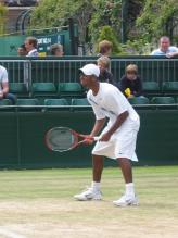 Donald Young awaits a serve.jpg