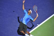 Donald Young ball toss and serve motion.jpg