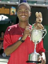 Donald Young holds his Australian Open Juniors championship trophy.jpg