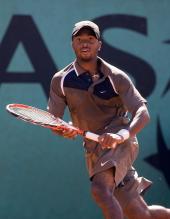 Donald Young looks intently at the flight of a ball.jpg