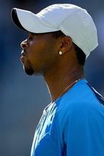 Donald Young looks on in a white cap.jpg