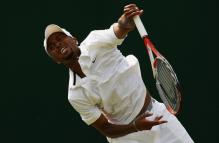 Donald Young Serve Follow-through.jpg