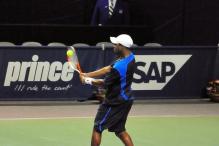 Donald Young two-handed backhand at contact.jpg