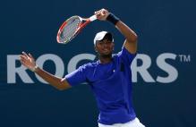 Donald Young spins a forehand.jpg