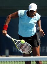 Ahsha Rolle hits a backhand volley.jpg