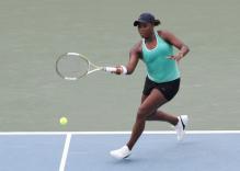 Ahsha Rolle hits a forehand down the line.jpg