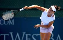 Chan Yung-Jan hits a serve.jpg