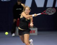 Nicole Vaidisova hits a big forehand.jpg