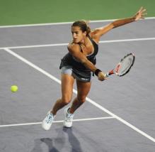 Amelie Mauresmo goes for a backhand volley.jpg